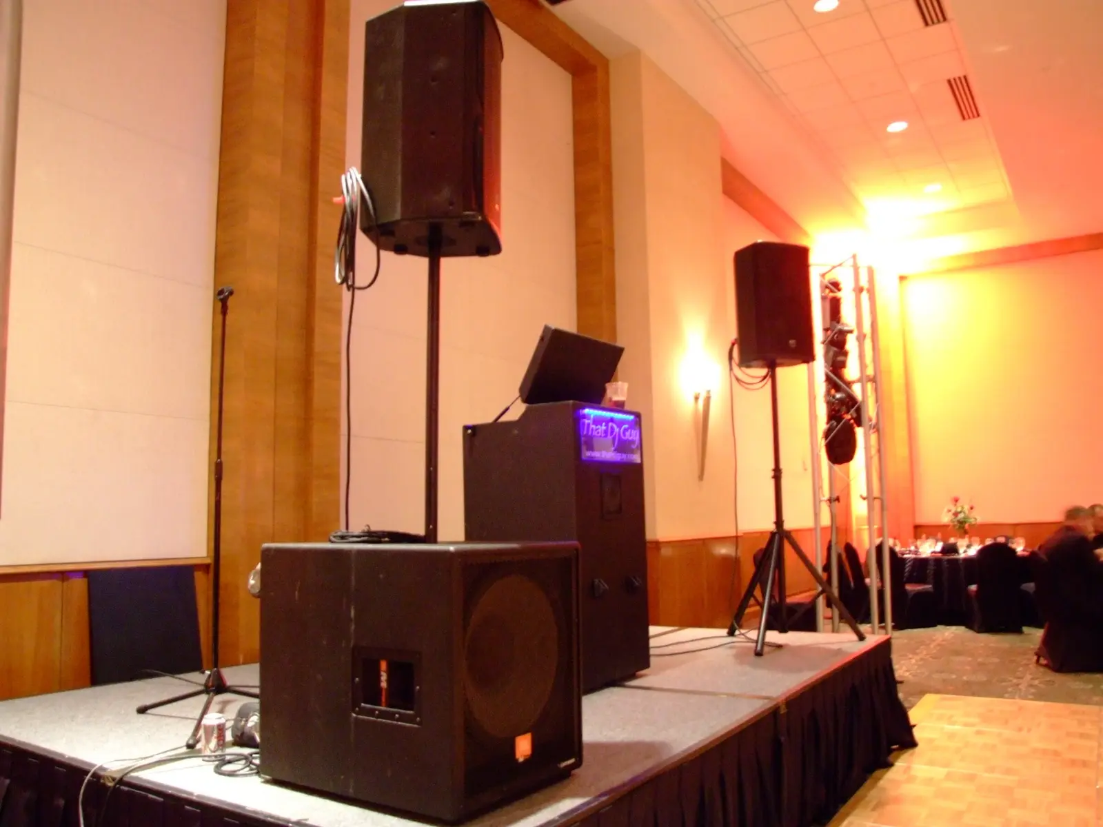 A complete ThatDjGuy sound and lighting system arranged beside a dance floor