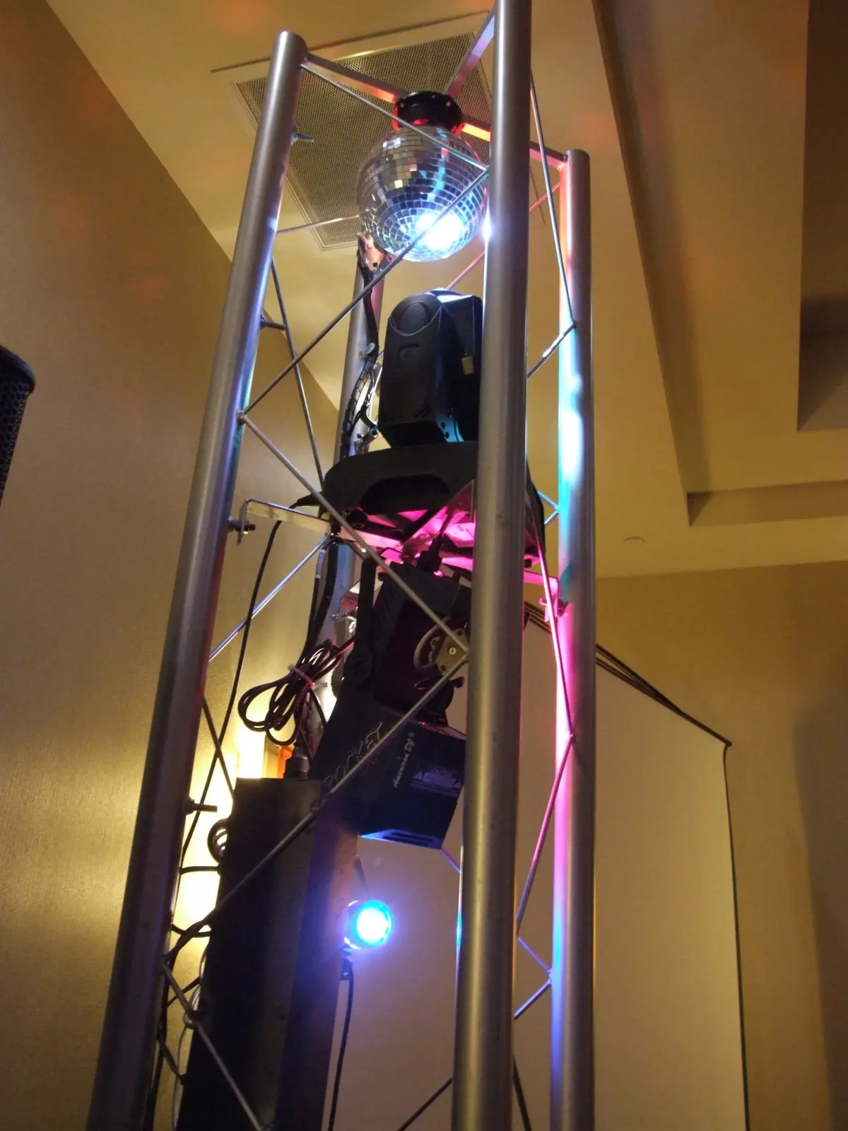 A close view of ThatDjGuy's professional lighting mounted neatly on a vertical truss