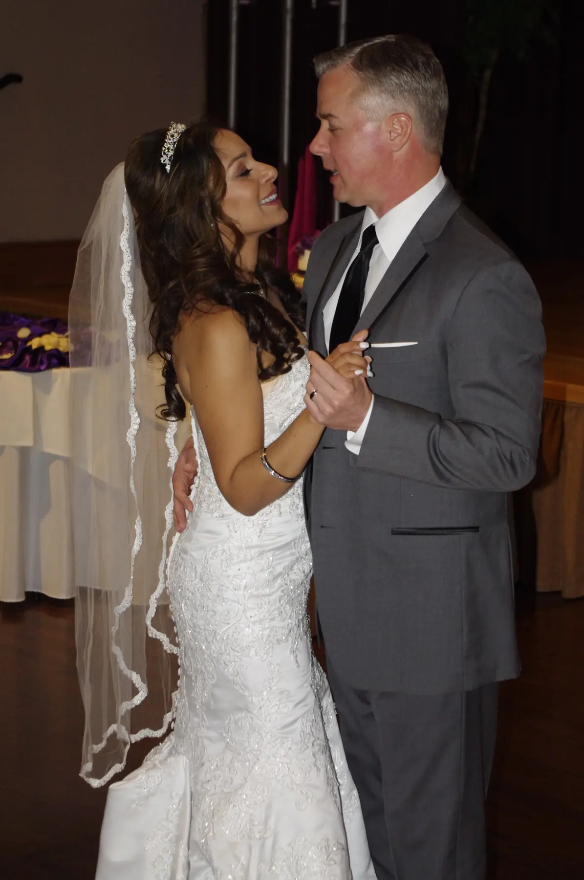 A bride sharing a close dance at her reception