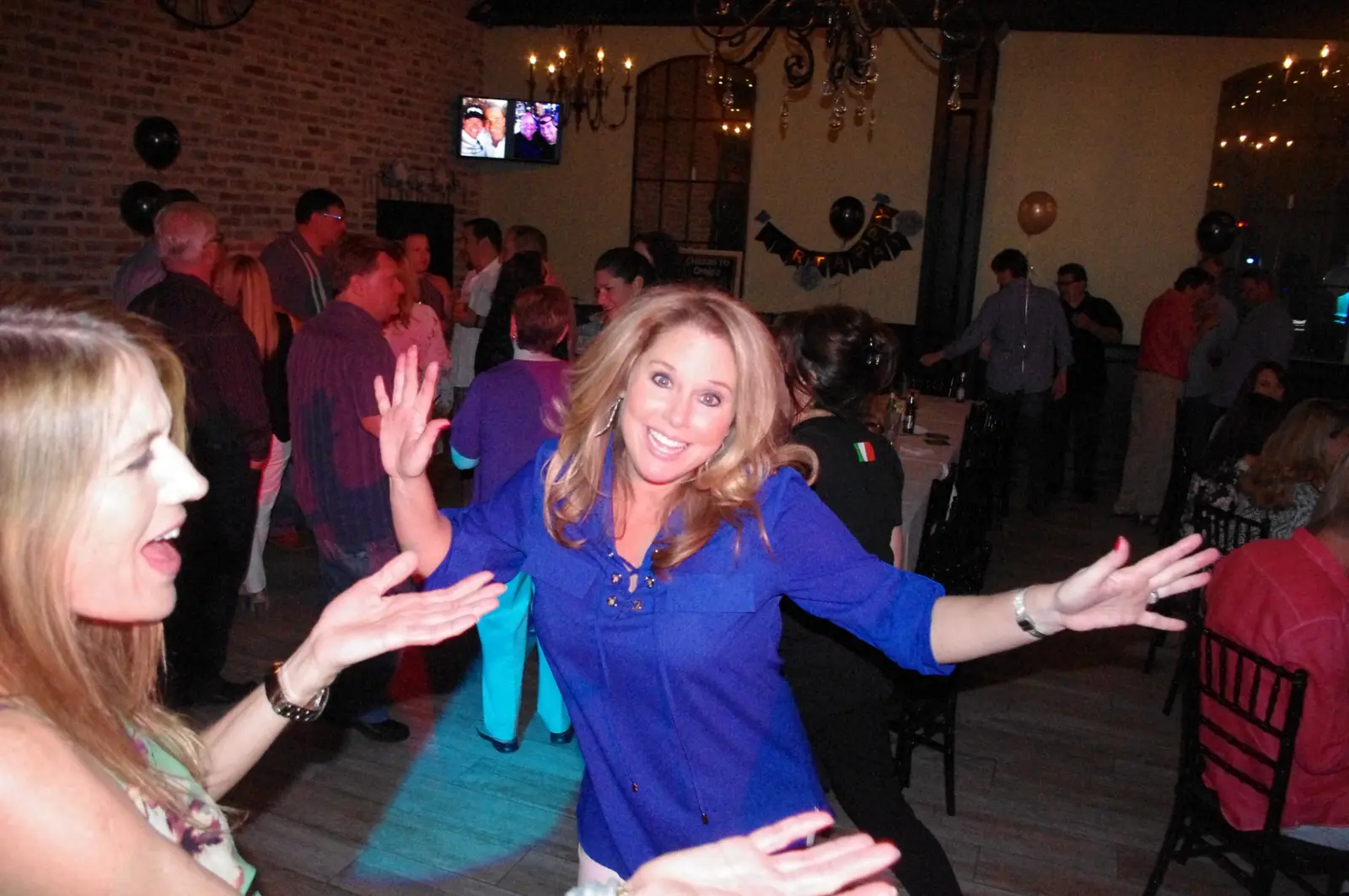 A guest dancing with friends at a party