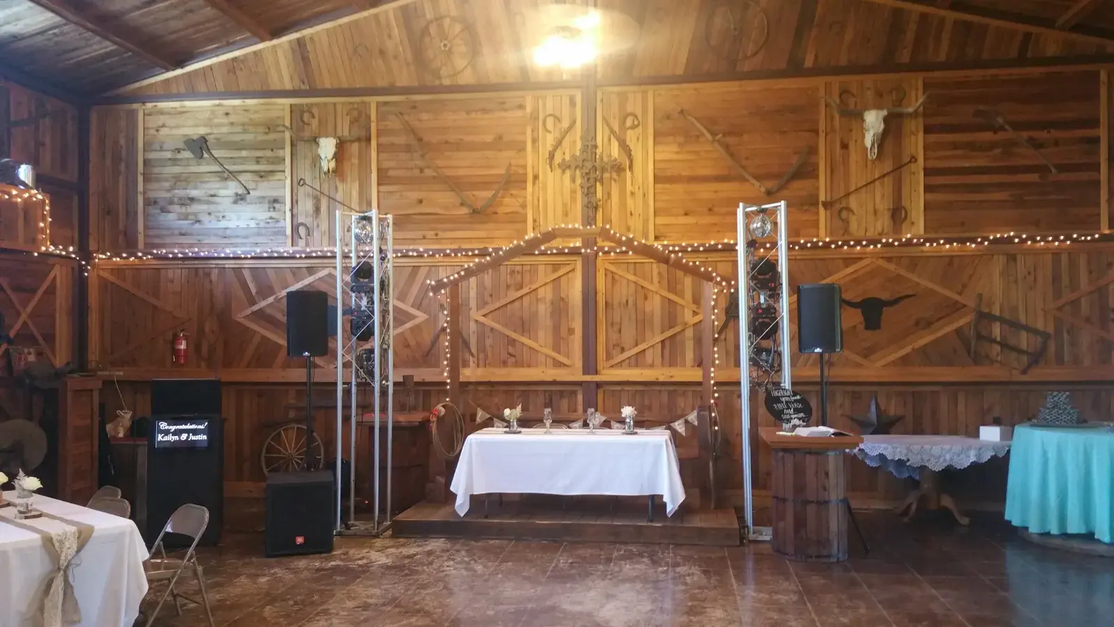 ThatDjGuy's compact custom sound and vertical lighting setup arranged neatly at a wedding venue